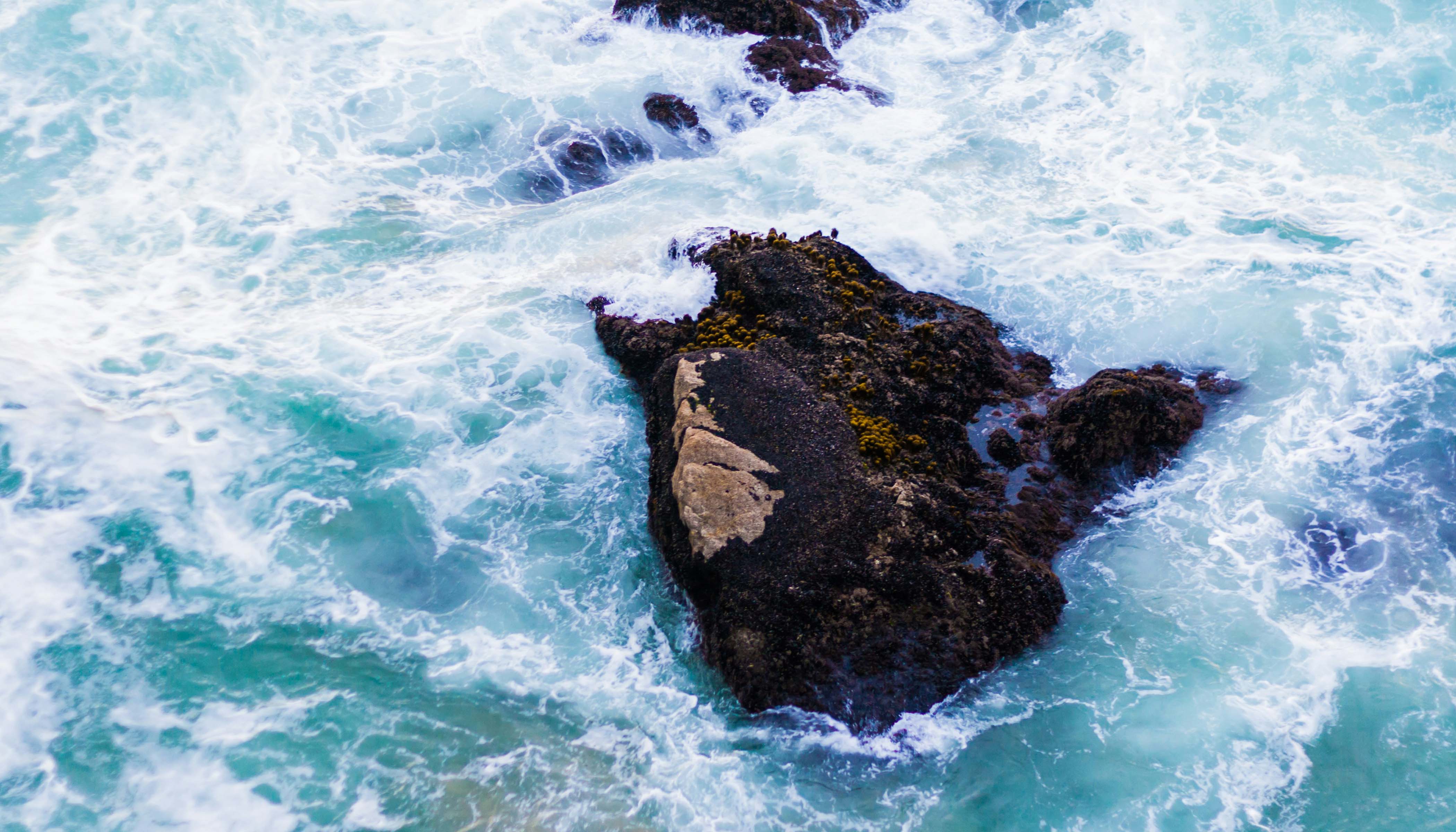 Scenery of a Rock on a Body of Water