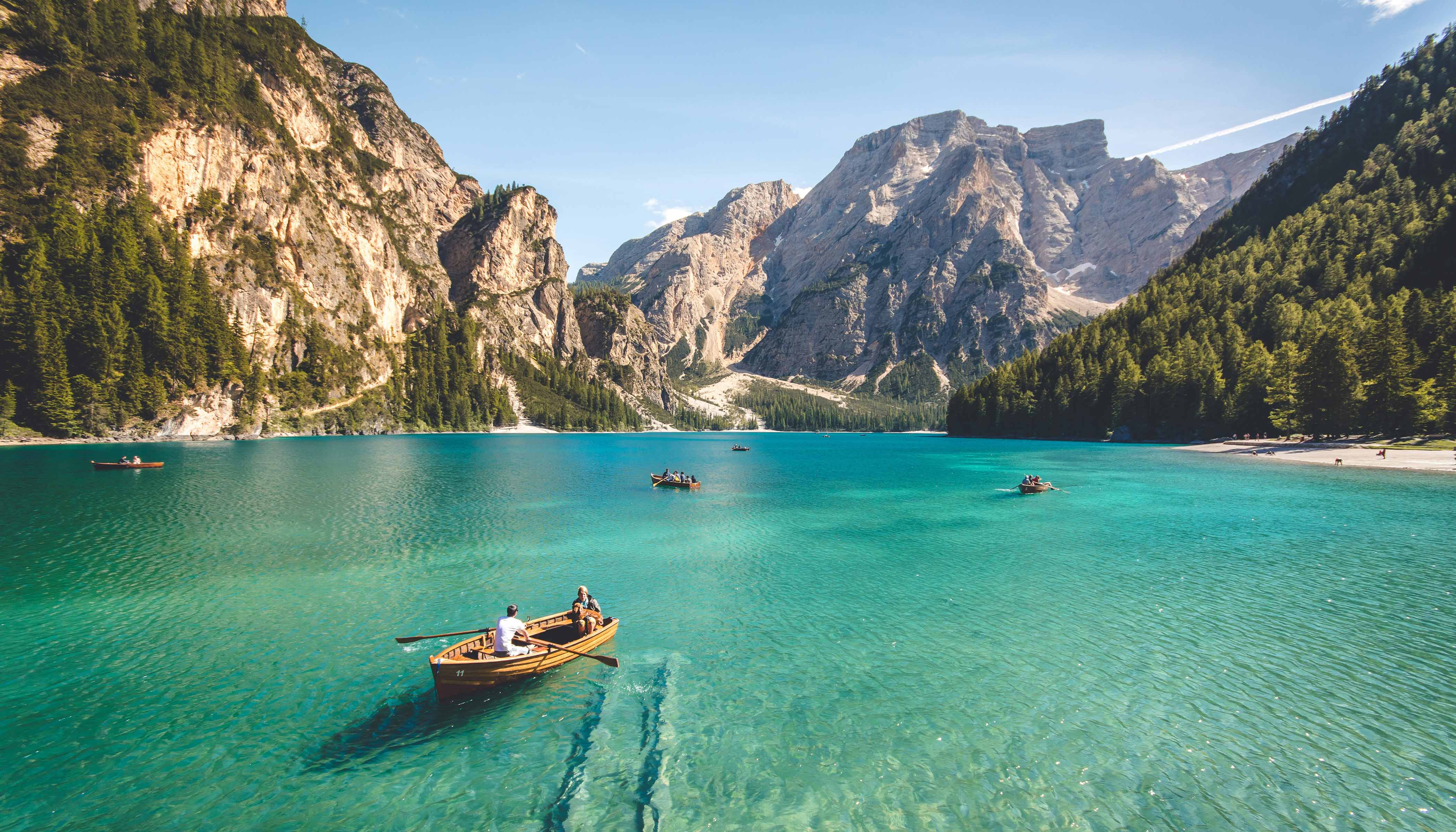 Three Rowboats on the Water With Cliffs Behind Three Rowboats on the Water With Cliffs Behind