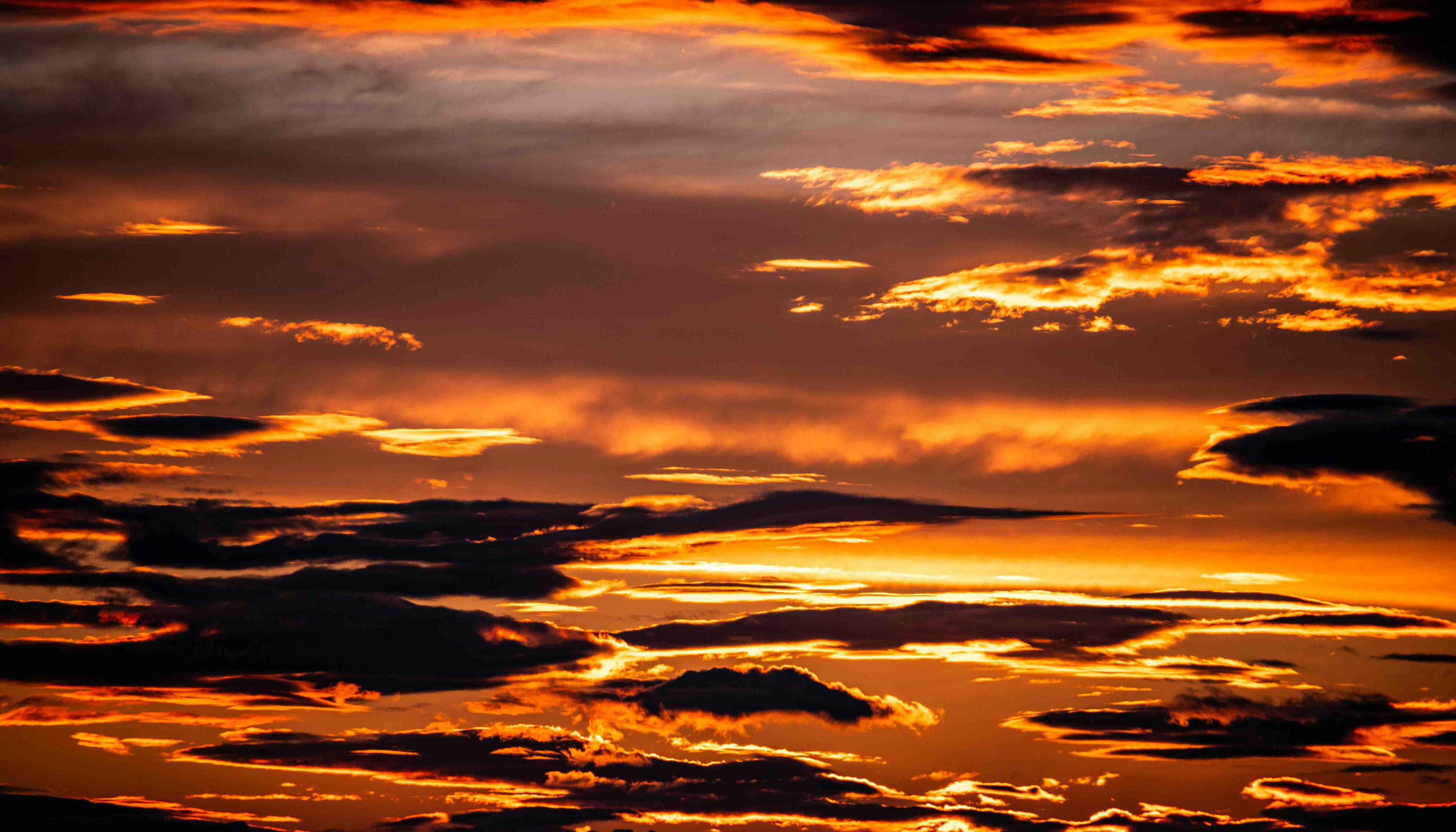 An Orange Sunset With Clouds